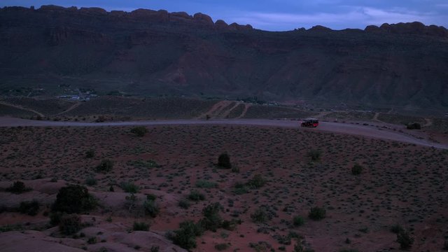 Aerial Drone Footage of Offroading Offroaders 4x4 Jeepers Driving Hell's Revenge Trail at Sand Flats Recreation Area Near Moab, Utah U.S.A.
