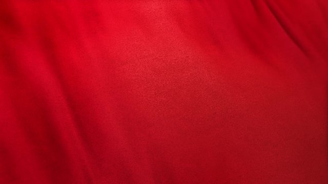red flag cloth in full frame with selective focus. Seamlessly looping 3D animation of scarlet ruby colored garment with clean natural linen texture for background banner or wallpaper use.