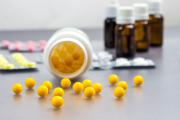 Vitamins, pills to treat colds. Glass Bottle with medicines. Cold remedies.