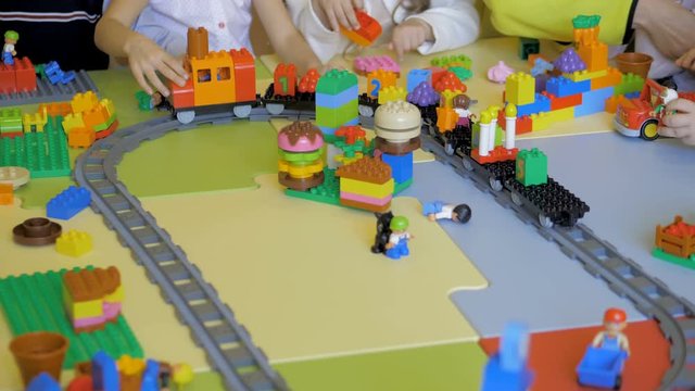 Kids creating robots with teacher. Early development, innovation, modern technology concept