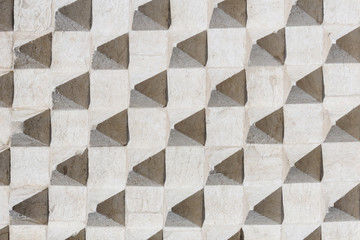 Texture with protruding pyramids of old concrete wall