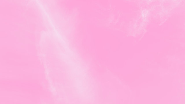 Pink sky background with soft delicate white clouds. Copy space. Romantic 16:9 format background
