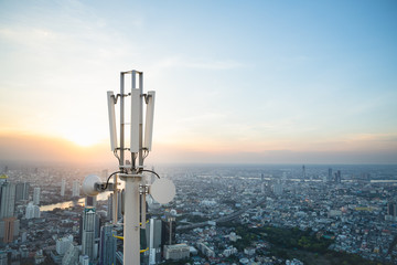 Telecommunication tower with 5G cellular network antenna on city background - Powered by Adobe