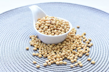 Raw soybeans (Glycine max) displayed in containers