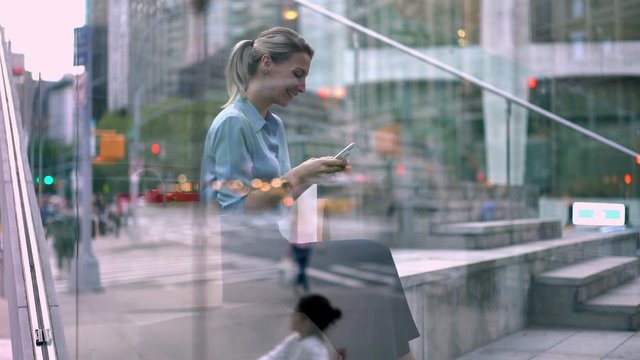 Young millennial woman checking delivery information on modern cellphone device using 4g wireless internet connection, female blogger networking mobile browser
