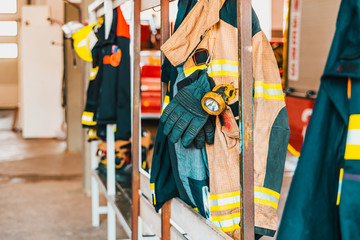 Fire retardant clothing worn by firefighters in case of emergency. - obrazy, fototapety, plakaty