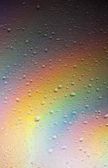 Abstract drops on a rainbow, can be used as a background. Concept, abstract art
