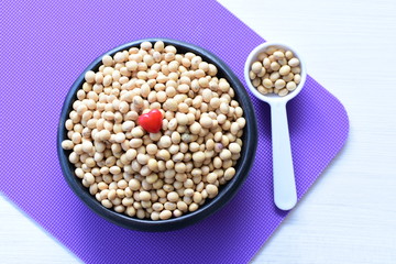 Raw soybeans (Glycine max) displayed in containers