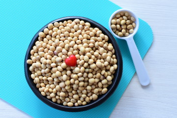 Raw soybeans (Glycine max) displayed in containers