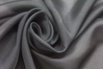Shiny grey cloth background dark curly background