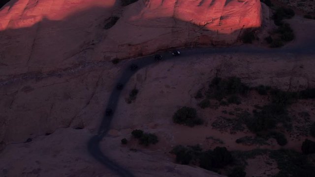 Aerial Drone Offroading 4x4 Four Wheelers Wheeling & Driving Hell's Revenge Trail at Sand Flats Recreation Area Near Moab, Utah U.S.A.