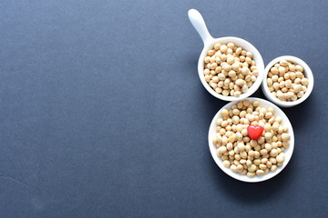 Raw soybeans (Glycine max) displayed in containers
