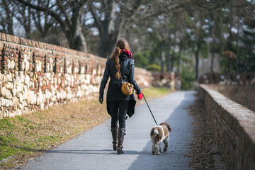 woman taking her dog for a walk