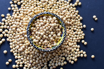 Raw soybeans (Glycine max) displayed in containers