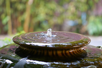 Close up jar fountain in the garden