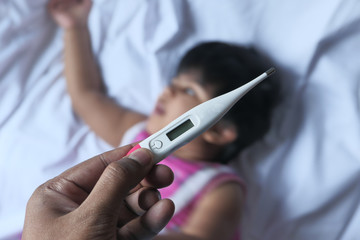 baby thermometer to measure the temperature of a sick baby, close up 