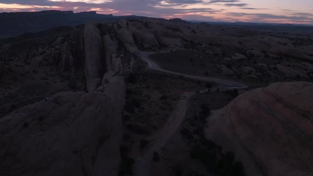 Aerial Drone Footage of Offroading 4x4 Jeepers Driving Hell's Revenge Trail at Sand Flats Recreation Area Four Wheelers Near Moab, Utah U.S.A.
