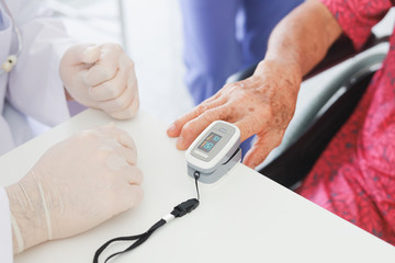 Asian Old Patient woman  Talking with Medical Doctor   in clinic office hospital