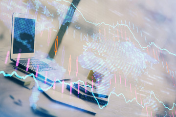 Forex Chart hologram on table with computer background. Double exposure. Concept of financial markets.