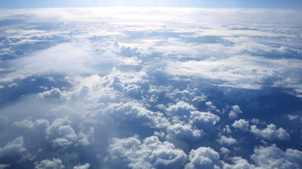 Fototapeta na wymiar Beautiful cloudy sky from aerial view. Airplane view above clouds.