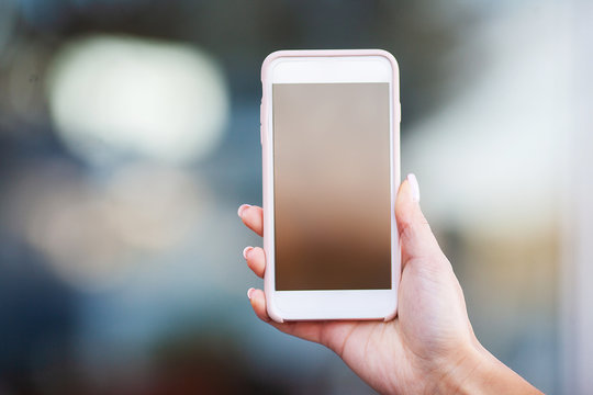 Woman Holding In Hand Phone Close Up Outdoors