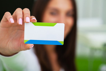 Doctor holding blank business card with place for text