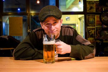 Guy with beer in the bar