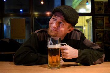 Guy with beer in the bar