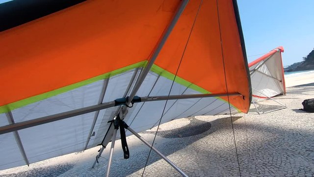 Hang Glider on beach close-up. 4k resolution footage of hangliders positoned next on the beach in Rio De Janeiro, Brazil.