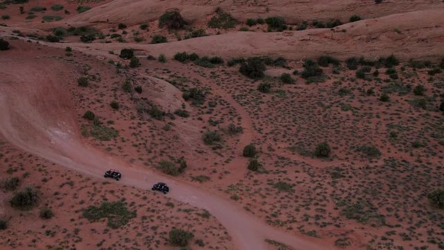 Aerial Drone Hell's Revenge Trail at Sand Flats Recreation Area Offroading 4x4 Driving Offroading Jeepers Near Moab, Utah U.S.A.