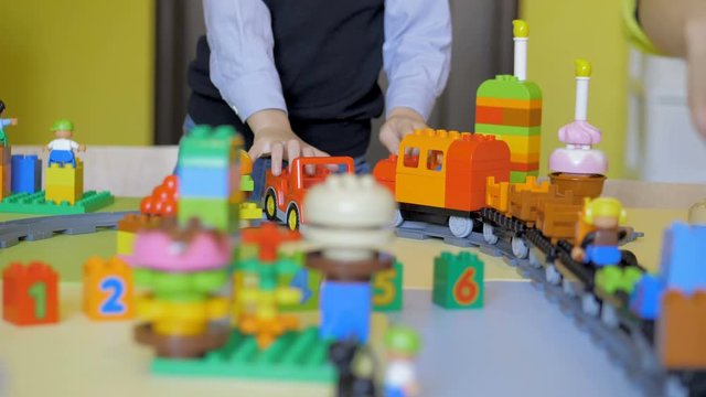Kids creating robots with teacher. Early development, innovation, modern technology concept