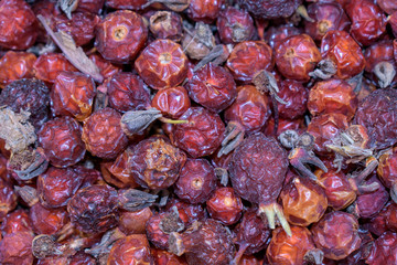 Dry red rose hips for background. Vitamin tea concept.