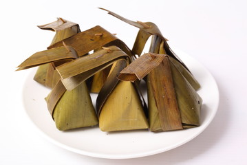 Khanom Sod-Sai thai name (Steamed Flour with Coconut Filling). Ancient Thailand dessert wrapped in banana leaves.