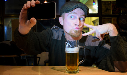 Guy and phone in the bar