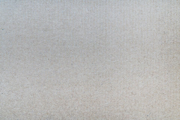 Close-up detail gray background from sheet of recycled carton. Close-up detail macrophotography view of abstract texture recycled ecofriendly cardboard material pattern background.