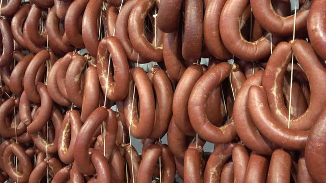 Fethiye, Turkey - 4th of March, 2020:  4K Zoom in close up rings of fresh made Turkish sucuk sujuk sausages