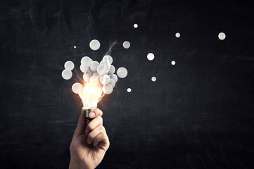 Pixelated light bulb. Development concept. Mixed media