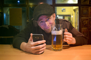 Guy with beer in the bar