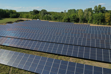 Power plant using renewable solar energy with sun. Solar panels in the field