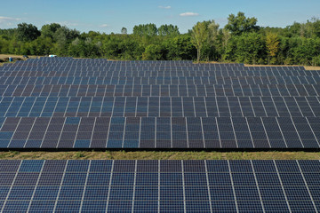 Power plant using renewable solar energy with sun. Solar panels in the field