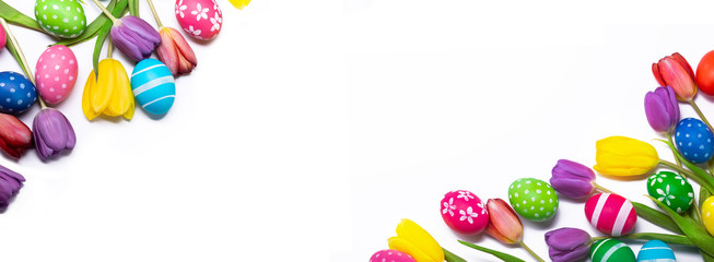 Easter eggs and tulips on white background