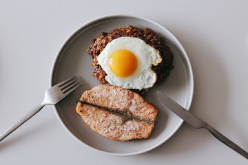 Fried egg and kimchi fried rice and salmon steak