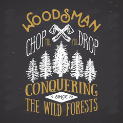 Obraz premium Lumberjack vintage label with two axes and trees. Hand drawn grunge vintage label, retro badge design, vector illustration on chalkboard background