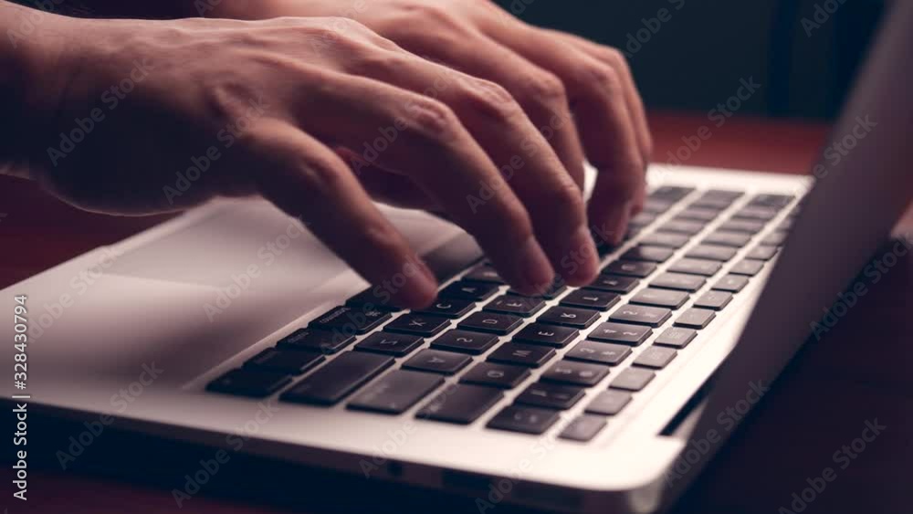 Poster businessman hands working and typing on laptop keyboard in 4k slow motion