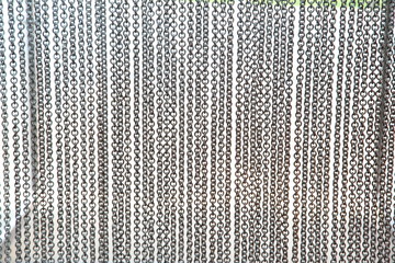 Metal curtain on the entrance of bird park.