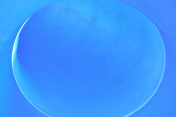 Exit view of a blue park slide