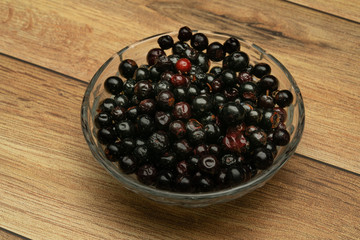 Dark blue small grapes or Vaccinium meridionale, agraz, close up.