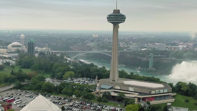 Aerial flying over The city of Niagara, Skylon Tower, hotels and casinos & the Niagara Falls. Ontario, Canada. 15 September 2019