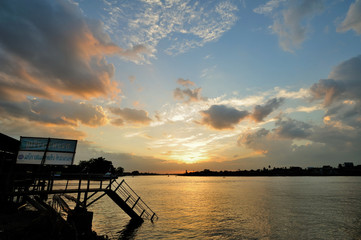 Naklejka na ściany i meble Sunset chaophraya river in bangkok,Thailand