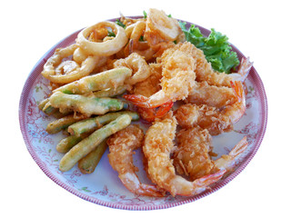Shrimp and fried vegetable on a plate  white backdrop